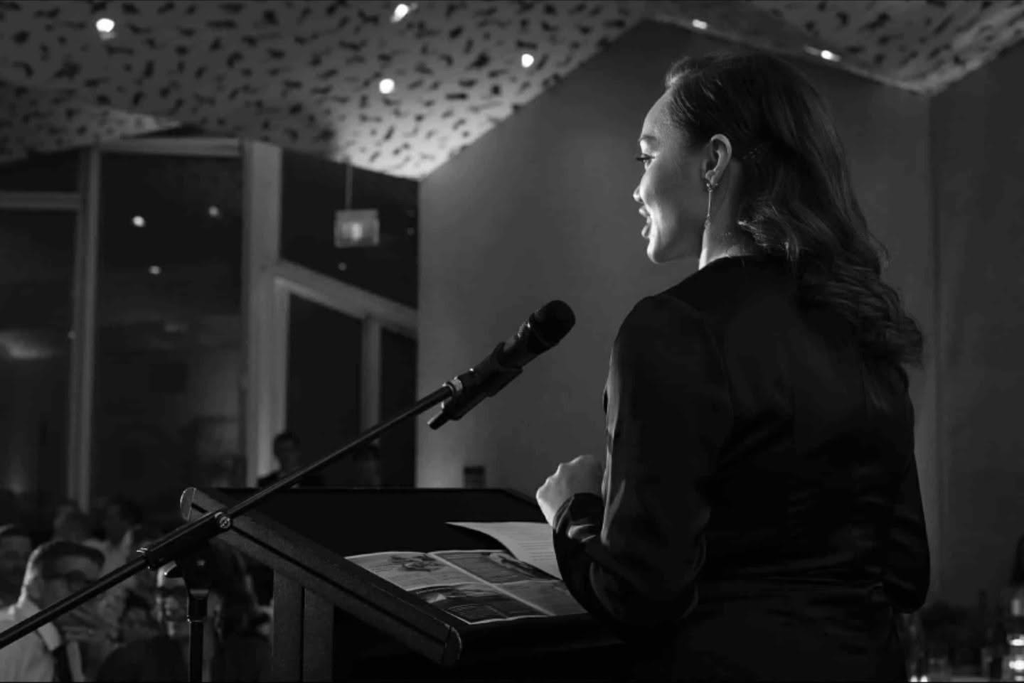 Elizabeth Costley calling an auction at the rostrum